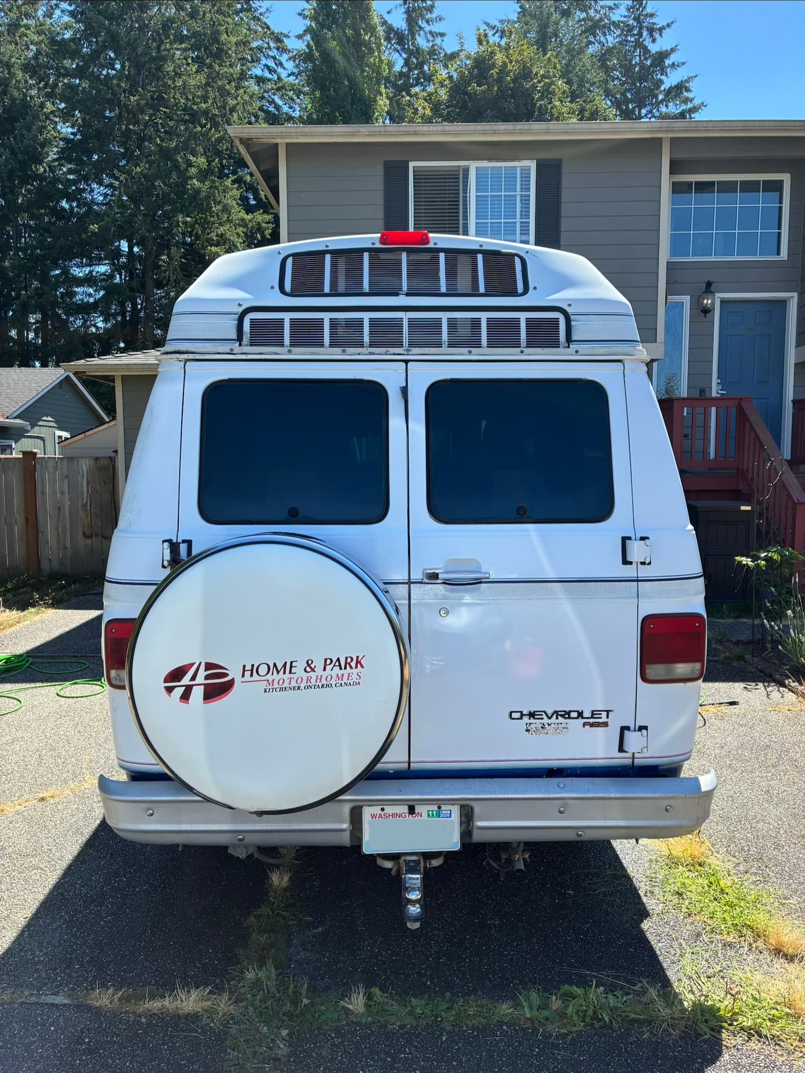 Camper van rear exterior after road grime cleanup and professional exterior wash and wax in Marysville, WA