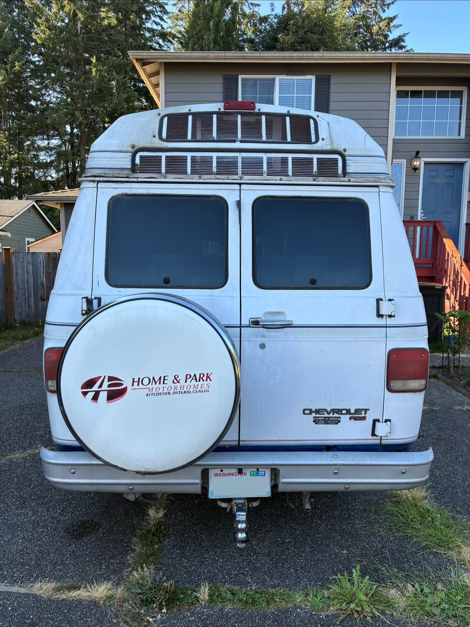 Camper van rear exterior with road grime before professional exterior wash and wax in Marysville, WA