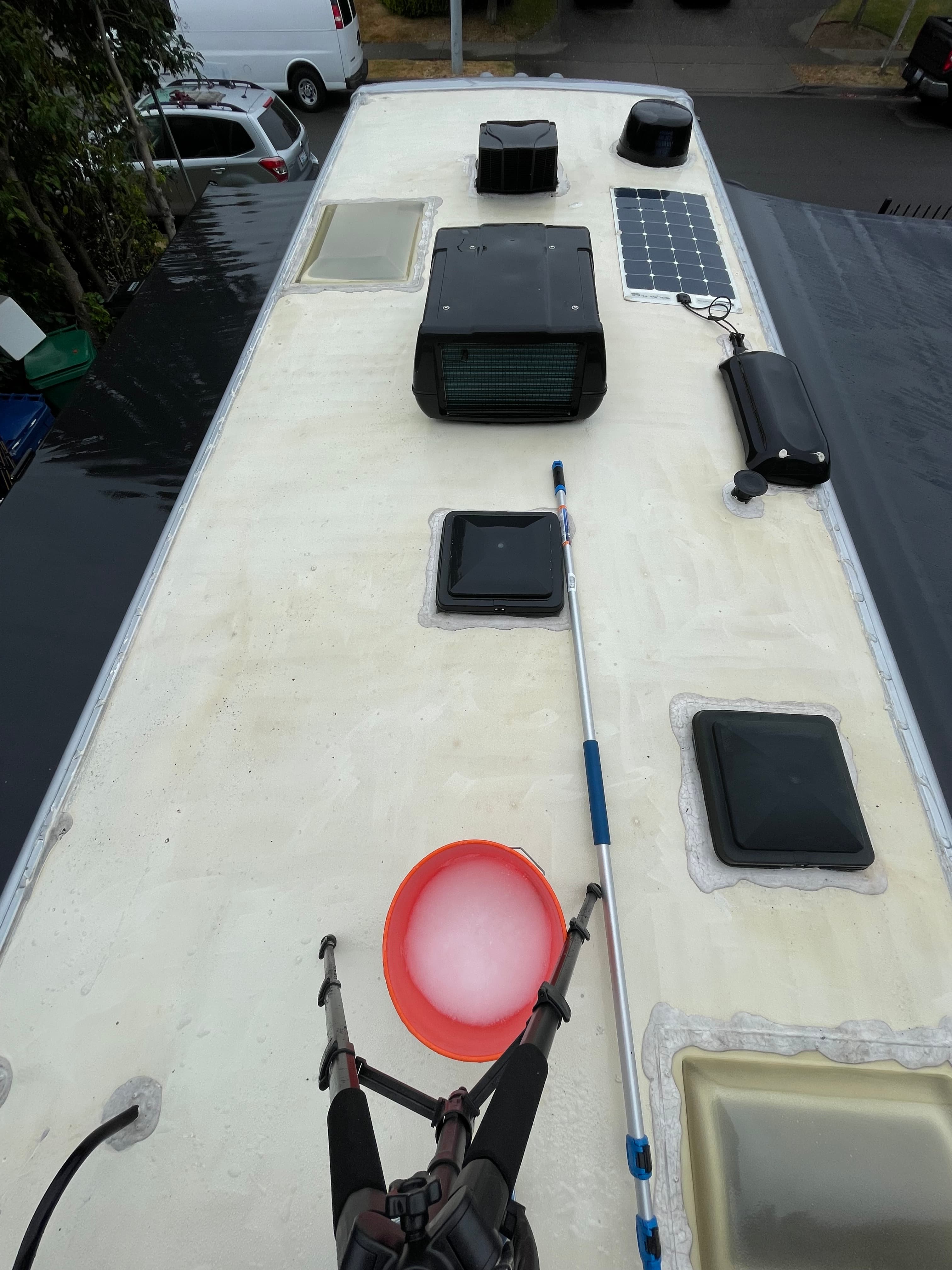 Class C motorhome roof after buildup cleanup and professional exterior wash and wax in Marysville, WA