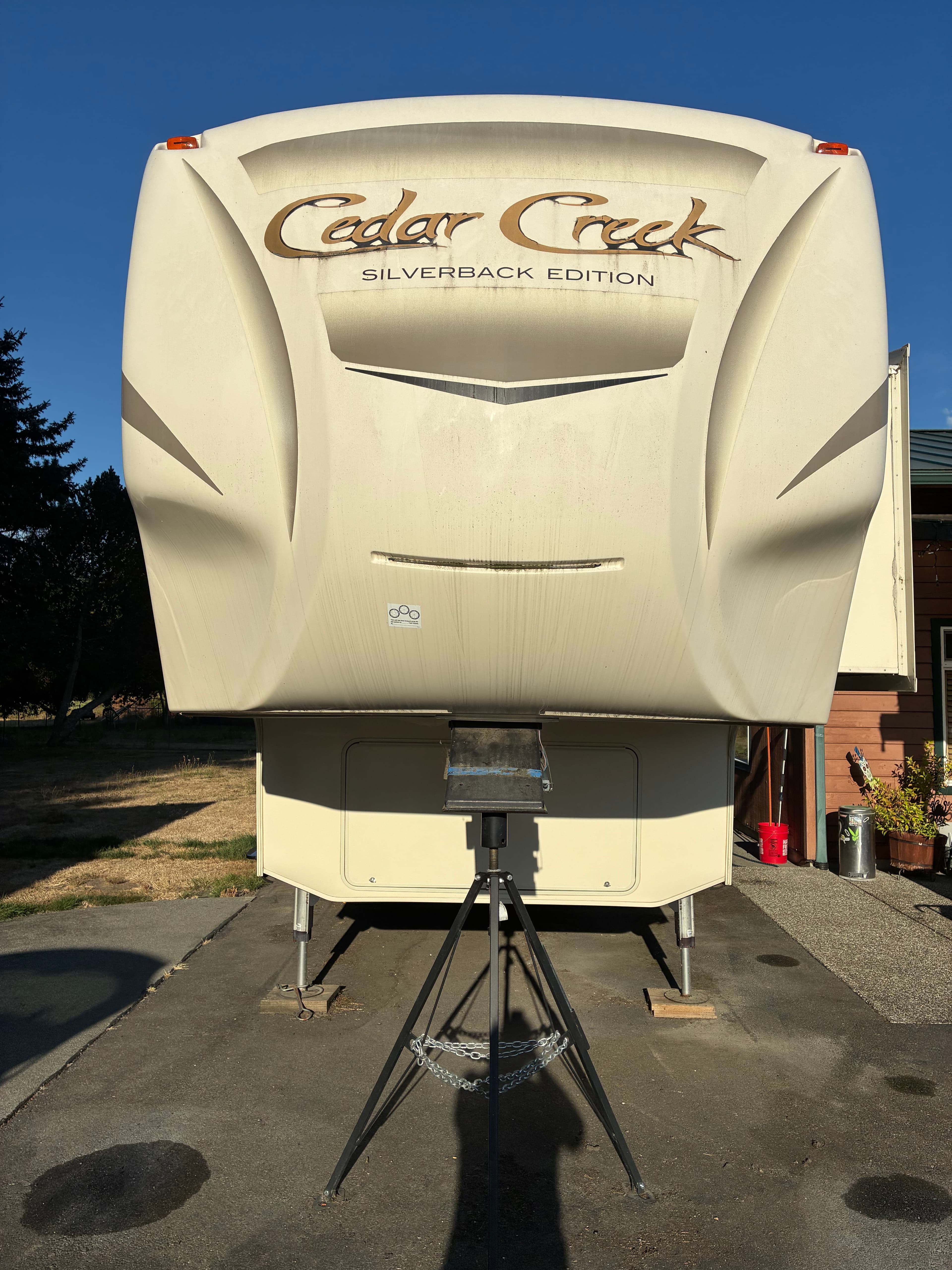 5th wheel front cap with black streaks before professional exterior wash and wax in Marysville, WA