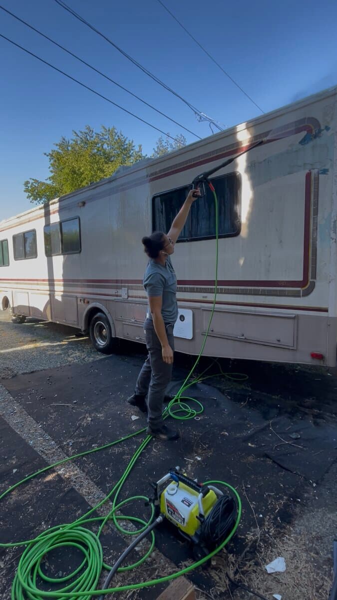 Power washing the side of a Class A motorhome